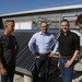 Die vier Herren vom Green Office vor der Solarthermieanlage auf dem RIZ Energie