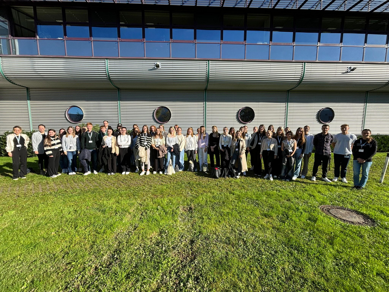 A group photo of people in front of a building